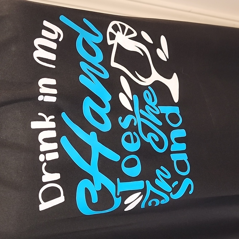 Black, long/ with slits on sides/Drink in hands toes in sand. Teal and White.